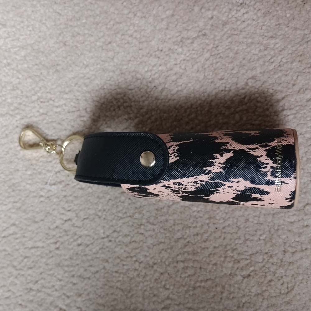 Stylish Black and Tan hand sanitizer holder And small Black Bag.